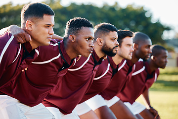 Image showing Man, huddle and team scrum for sports coordination, collaboration or serious on the grass field. Group of sport men in fitness training, planning or strategy getting ready for game, match or start