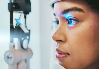 Image showing Optometry, medical and eye exam with black woman and consulting for vision, healthcare and glaucoma check. Laser, light and innovation with face of patient and machine for scanning and ophthalmology