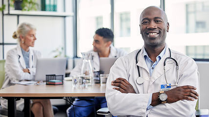 Image showing Arms crossed, portrait and a doctor in healthcare meeting with vision, motivation and confidence. Happy, medicine and an expert African man in medical workshop, seminar or conference at a hospital