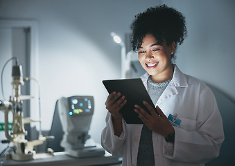 Image showing Tablet, medical doctor and black woman in hospital for online consultation, research or telehealth at night. Healthcare clinic, technology and happy female physician with touchscreen for wellness app