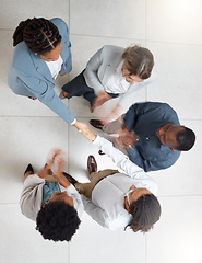 Image showing Handshake, team applause and business people in office with thank you and success of meeting. Onboarding, shaking hands and corporate partnership agreement from above of advertising and b2b deal