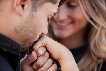 Image showing Love, man kiss hand of woman and celebration for marriage, relationship and happiness for romance. Romantic, couple and gesture for joy, Valentines day and bonding together, loving and achievement