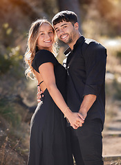 Image showing Portrait, love and real couple holding hands with smile in celebration for marriage commitment. Bonding, man and happy woman embrace with happiness, romance and trust on honeymoon vacation