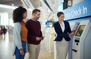 Image showing Woman, service agent and couple at airport by self check in station for information, help or FAQ. Happy female passenger assistant helping travelers register, book air flight or ticket for departure