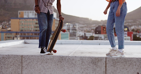 Image showing Skateboard, friends and city with a man and woman skating on a rooftop outdoor during the day. Sport, exercise and summer with a male and female training as a street skater in an urban town