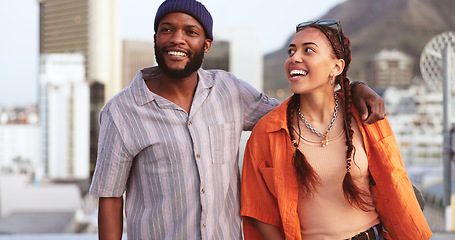 Image showing Comic, communication and interracial couple walking in the city, talking and on a date together. Happy, smile and black man and woman in a funny, comedy and crazy conversation while on a walk