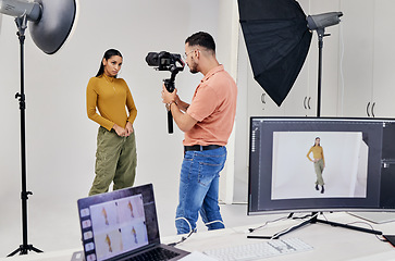 Image showing Photography, shooting and photographer with woman fashion model in studio for creative, advertising and image. Media, backstage and profession man videographer with girl and equipment for photoshoot
