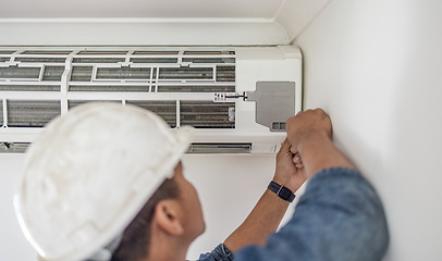 Image showing Air conditioner, ac repair and maintenance of a handyman and builder working on home renovation. Electric technician, service worker and contractor in a house for equipment installation on wall