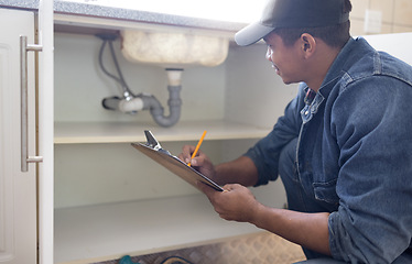 Image showing Plumber, sink maintenance document and plumbing check of a handyman in a kitchen. Water pipe installation, home repair checklist and builder in a household for building construction and inspection