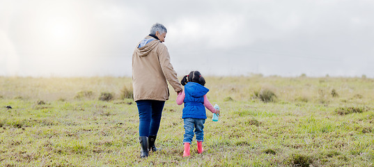 Image showing Back, love and grandmother with girl, countryside and bonding together, happiness and loving. Family, granny and granddaughter in nature, morning and walking for fresh air, balance and affection