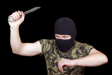 Image showing The murderer with a knife in a black mask