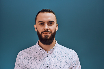 Image showing A bearded man portrati isolation on dark blue background