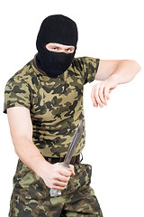 Image showing The criminal with a knife in a black mask over white