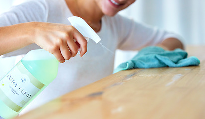 Image showing Closeup, hands and woman with spray bottle, detergent and hygiene for protection, wellness and spring cleaning. Zoom, female cleaner and lady with liquid, table and surface disinfection and safety