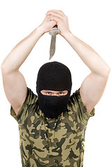 Image showing The killer with a knife in a black mask over white