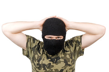 Image showing The surrendered terrorist in a black mask over white