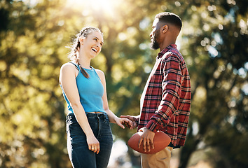 Image showing Couple, American football in park and happy together, summer with hand holding outdoor and sports in the sun. Commitment, trust and fitness, black man and woman, interracial relationship and care