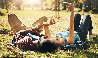 Image showing Love, selfie and couple in park, grass and bonding with romance, dating and relationship. Romantic, man and woman with smartphone, peace sign and loving together, happiness and outdoor for fun or joy