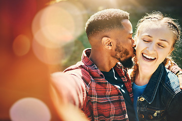 Image showing Selfie, kiss and interracial couple on a date in nature for support, love and bonding in Australia. Freedom, trust and black man and woman with kissing affection, quality time and photo for memory