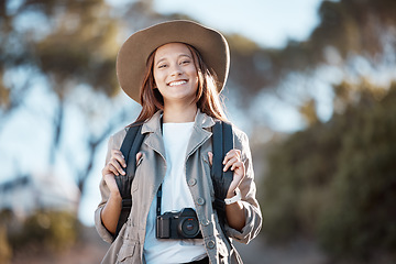 Image showing Portrait, hiking and woman in nature, fitness and exercise for wellness, fresh air or freedom. Face, female tourist in forest or lady in mountains, hiker or on holiday for adventure, journey or relax