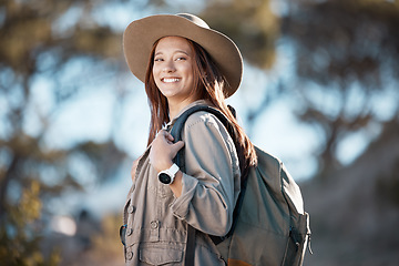 Image showing Hiking woman, portrait and smile for adventure, summer and explore forest with backpack, excited and happy. Explorer girl, woods and travel with freedom, nature vacation and holiday for training goal