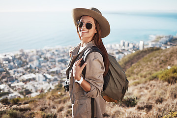 Image showing Portrait, hiking and woman with view, fitness and happiness for exercise, fresh air and balance. Face, happy female hiker and lady with sunglasses, nature and freedom on mountain, backpack or explore