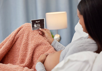 Image showing Pregnancy, ultrasound scan and woman in bed with x ray photograph of baby, infant and child at home. Love, family and excited, loving and happy pregnant mother rest with prenatal picture in bedroom