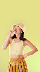 Image showing Pizza, lunch and eating woman with food while isolated on a yellow background in a studio. Hungry, dinner and Asian girl enjoying a snack, take away or unhealthy meal with mockup on a backdrop