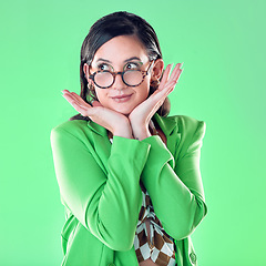 Image showing Woman, teacher and hands on face with green screen, studio background and thinking with vision for career. Young model, education and ideas with glasses, mockup and with fashion, pride and happiness