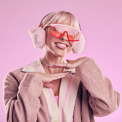 Image showing Fashion, tongue and funny face of a woman quirky in studio for comic glasses on pink background. Aesthetic model person with thinking funny thought for edgy vaporwave trend with creativity and color