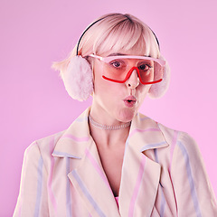 Image showing Portrait, fashion and woman with unique style, trendy and pouting lips in studio background. Face, female and girl with glasses, funky and young person with casual, edgy and fu outfit on backdrop