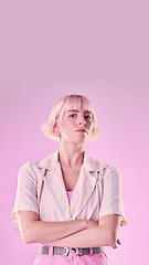 Image showing Angry, serious and portrait of a woman with arms crossed isolated on a pink background in a studio. Expert, professional and stylish, trendy and fashionable girl with frustrated expression and mockup