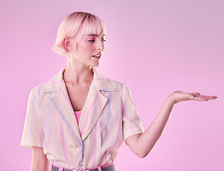 Image showing Woman, mockup space and promotion on pink background, studio offer and advertising color. Female model, hands and marketing product placement of branding, commercial mock up and presentation of hands