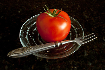 Image showing Fresh tomato on the glass plate.