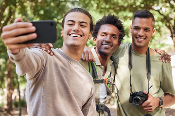 Image showing Friends take selfie, hiking and outdoor in nature, men with phone, camera and happy trekking in woods. Social media, post and travel with fitness and group, smile in picture and trust on adventure