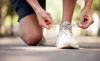 Image showing Park, shoelaces and ground with man hands, outdoor adventure and training for wellness in summer. Shoes, sneakers and start morning for fitness, exercise and strong body development in nature park