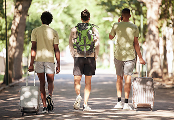 Image showing Friends back, walk and park with suitcase, travel and phone call for planning on outdoor adventure. Young men, group and backpack for holiday, vacation and together for diversity, journey and bonding