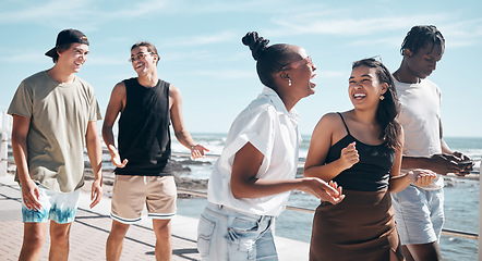 Image showing Friends, laughing and walking by beach, ocean or sea in social gathering joke, group vacation comedy or summer holiday. Smile, happy men and diversity women in travel, bonding or sharing funny story