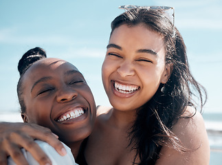 Image showing Woman, friends and hug with smile for beach day, summer vacation or travel together outdoors. Portrait of happy women laughing in joy for friendship, travel or fun holiday bonding by the ocean coast