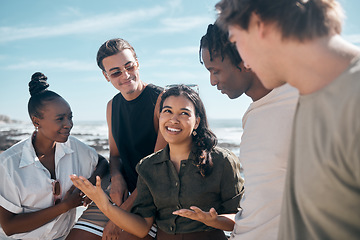 Image showing Woman, talking and bonding friends by beach, ocean or sea in group social gathering, community trust or summer holiday vacation. Smile, happy and diversity people in travel location, relax or freedom