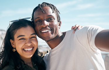 Image showing Smile, portrait and selfie of couple at beach outdoors, having fun or enjoying holiday time. Travel face, love diversity and man and woman take photo for social media, profile picture or happy memory