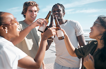 Image showing Cheers, beer and friends at the beach on a vacation, adventure or weekend trip in summer. Toast, alcohol and group of people enjoying a drink together on the promenade by the ocean while on holiday.