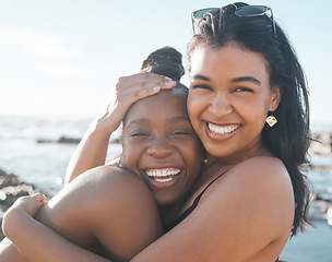 Image showing Women, portrait or friends hug by beach, sea or ocean in summer holiday bonding, support vacation or girls travel location. Smile, happy or black people in embrace, social gathering or relax nature