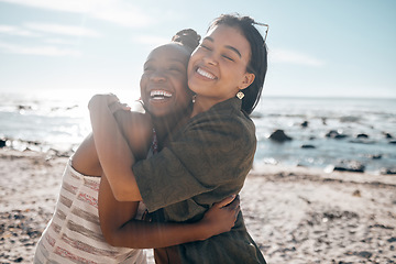 Image showing Women, bonding and friends hug by beach, sea or ocean in summer holiday, support vacation or girls travel trip. Smile, happy and black people in embrace, social gathering or relax in nature location