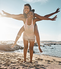 Image showing Friends, laughing or piggyback airplane by beach, ocean or sea in social gathering, vacation comedy or summer holiday. Smile, happy or black woman carrying girl in travel fun, bonding or comic games