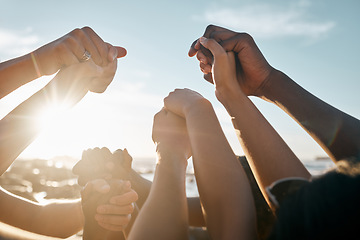 Image showing Friends, bonding and holding hands on beach social gathering, community trust support or summer holiday success. Men, women and diversity people in solidarity, team building or travel mission goals