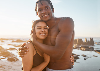 Image showing Couple portrait, swimsuit or sunset beach hug in relax romance holiday, love vacation date or bonding summer location. Smile, black woman or man in swimwear embrace, freedom trust or travel support