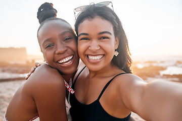 Image showing Women, portrait and selfie of friends at beach outdoors bonding, laughing and enjoying holiday sunset. Travel face, freedom and girls taking pictures for social media, profile picture or happy memory
