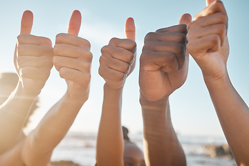 Image showing People, hands and diversity with thumbs up at beach for good job, agreement or success together. Hand of group showing thumb emoji, yes sign or like for teamwork, winning or trust in solidarity