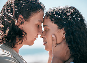 Image showing Face, love and summer with a couple together at the beach, sharing an intimate moment outdoor closeup. Trust, travel or relax with a young man and woman enjoying a romantic date bonding in nature